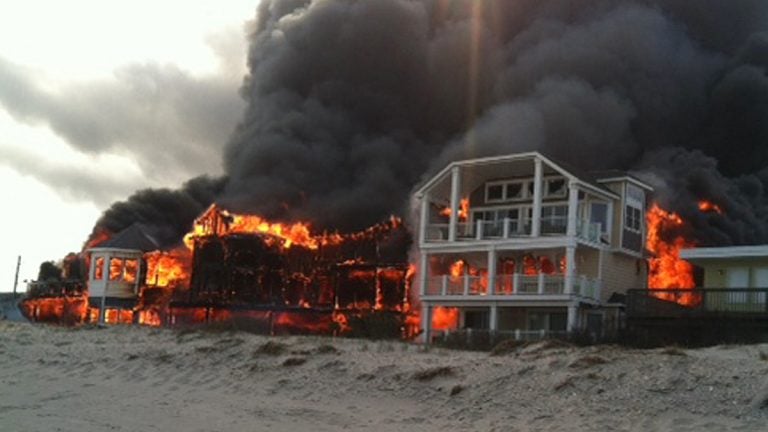  Fire engulfs three homes near the beachfront, Friday, April 18, 2014, in Sea Isle City, N.J.  (AP Photo/Joanne Dollarton) 