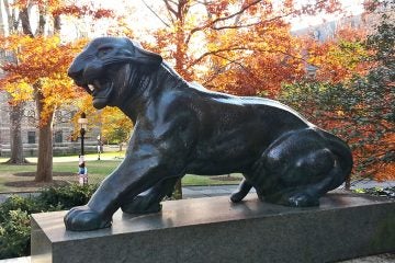  One of two matching tiger statues behind Nassau Hall. (Alan Tu/WHYY) 