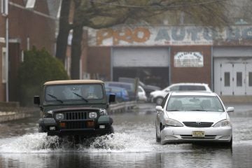  Flooded street in Bogota, N.J. on Thursday, May 1, 2014, (AP Photo/Julio Cortez) 