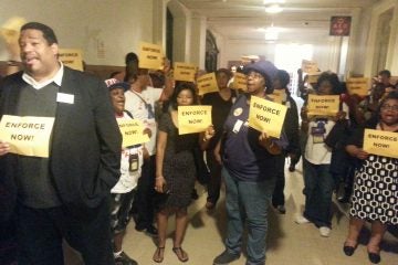 Workers protest outside Mayor's office