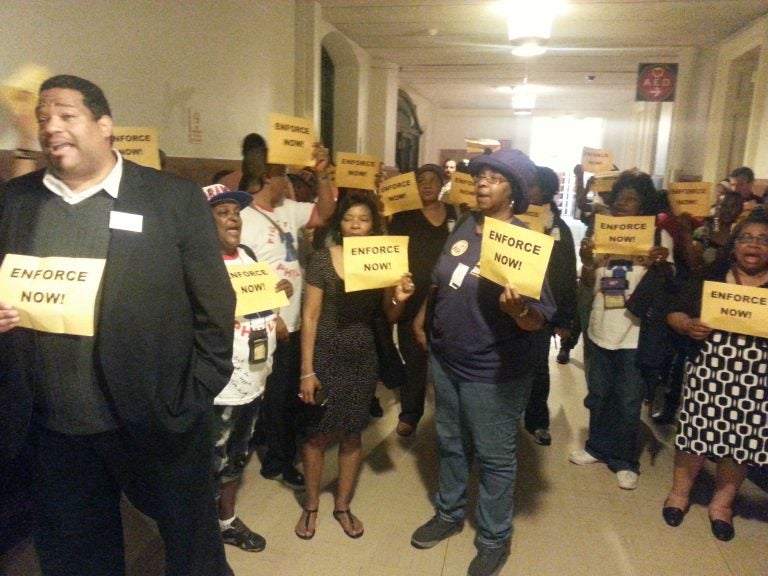 Workers protest outside Mayor's office