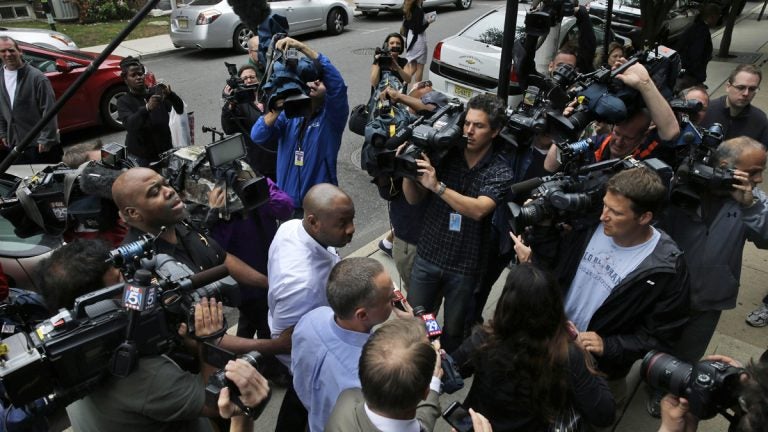  Kevin Roper, center, is surrounded by media  as he leaves a court appearance Weds, June 11, 2014, in New Brunswick, N.J.  (AP Photo/Mel Evans) 