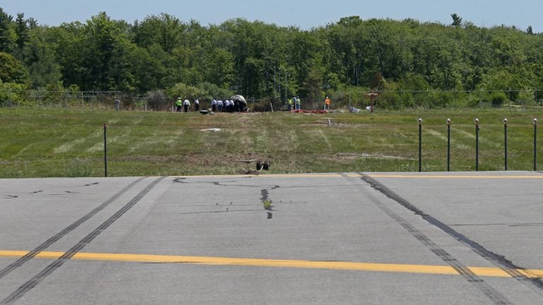  Skid marks at the end of the runway at Hanscom Field. (AP Photo/Boston Herald, Mark Garfinkel, Pool) 