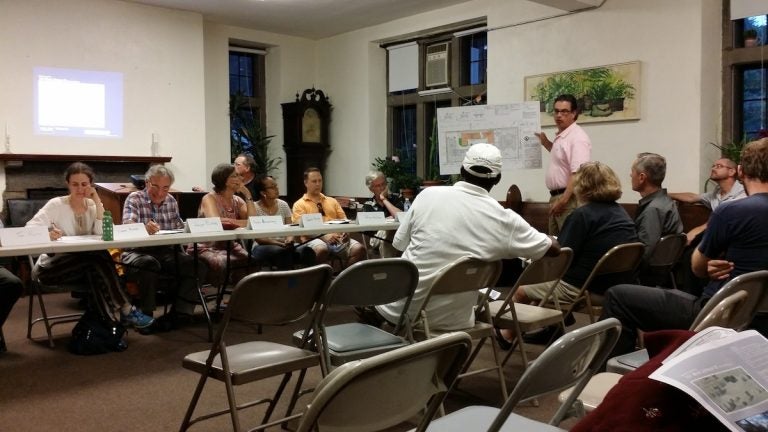  Zoning attorney Bill Curr presents revised building plans to West Mt. Airy Neighbors members and residents at Wednesday's meeting. (Queen Muse/for NewsWorks) 