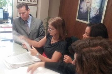  From left, Essex County Freeholder Brendan Gill, Marcia Marley of BlueWave NJ, Analilia Mejia of New Jersey Working Families and Dena Mottola Jaborska of New Jersey Citizen Action review petitions to be submitted in Montclair, where a paid sick leave will be on the November ballot. 