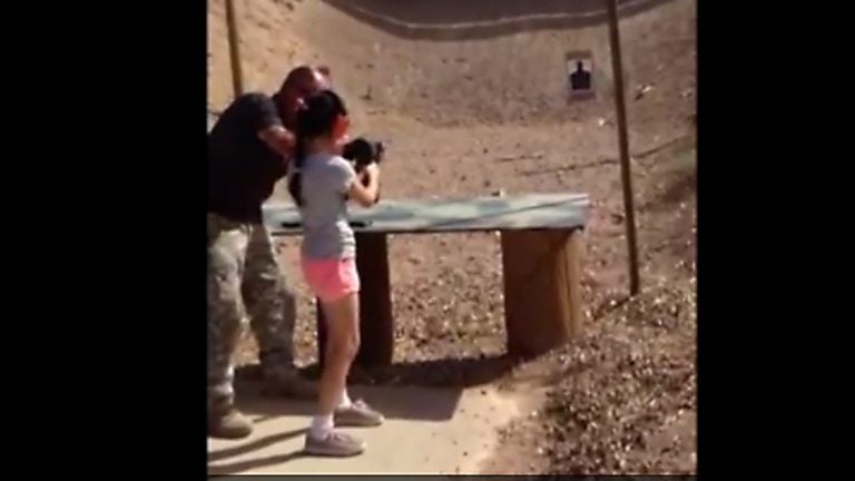  Image from a video released showing the girl firing her first few shots.  