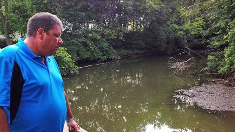  Hillsdale Fire Department Captain Tom Kelley looks out on Pascack Brook, a source of regular flooding in his community. 