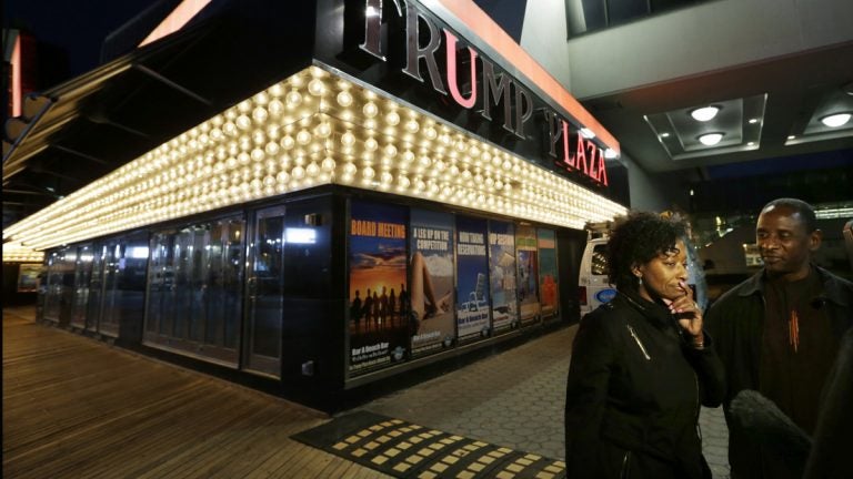  Ruth Hardrick, a dealer who worked at Trump Plaza Hotel & Casino for 26 years, stands with friend, Anthony Powell, on The Boardwalk, as she answers a question after the casino closed early Tuesday, Sept. 16, 2014. (AP Photo/Mel Evans) 