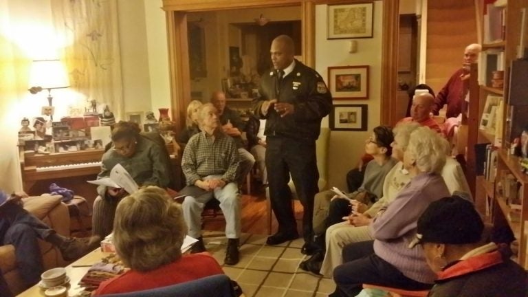  Captain Sekou Kinebrew meets with members of the Mt. Airy-Nippon-Bryan-Cresheim Town Watch. (Queen Muse/for NewsWorks) 