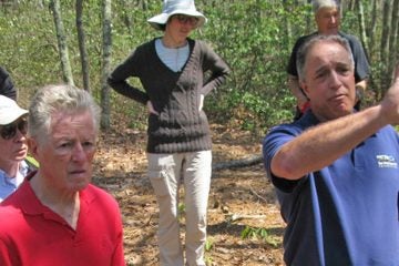  Former Gov. James Florio, left, and Emile DeVito, science director for New Jersey Conservation Foundation on the site where Six Flags wants to build its massive solar farm. 