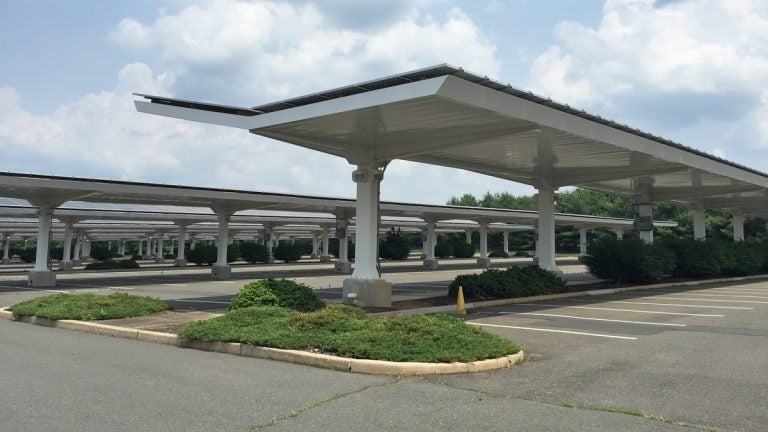  Solar panels cover these parking shelters at the Dow Jones complex in Monmouth Junction, NJ. (Alan Tu/WHYY) 