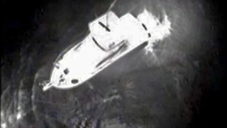  View from a Coast Guard helicopter showing a boat near where the man was discovered. Image courtesy of the US Coast Guard) 