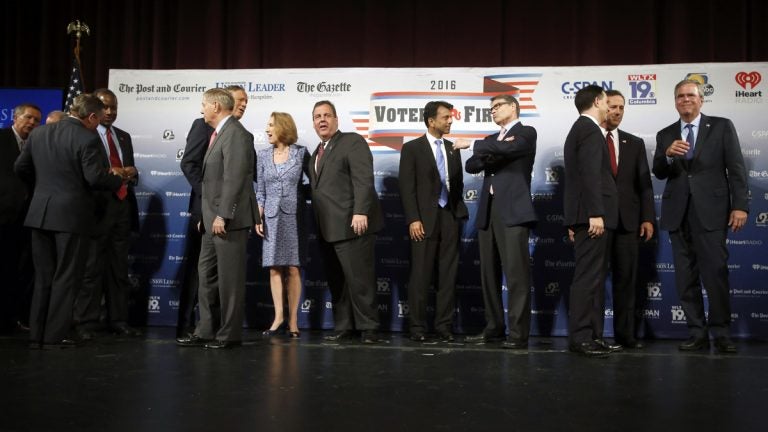 GOP 2016 New Hampshire Republican presidential candidates speak among themselves after last night's forum in N.H. Steven DiSalvo. (AP Photo/Jim Cole)