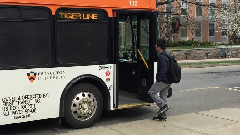  A university bus picks up a student in front of the Friend Center for Engineering Education in Princeton, NJ. (Alan Tu/WHYY, file) 