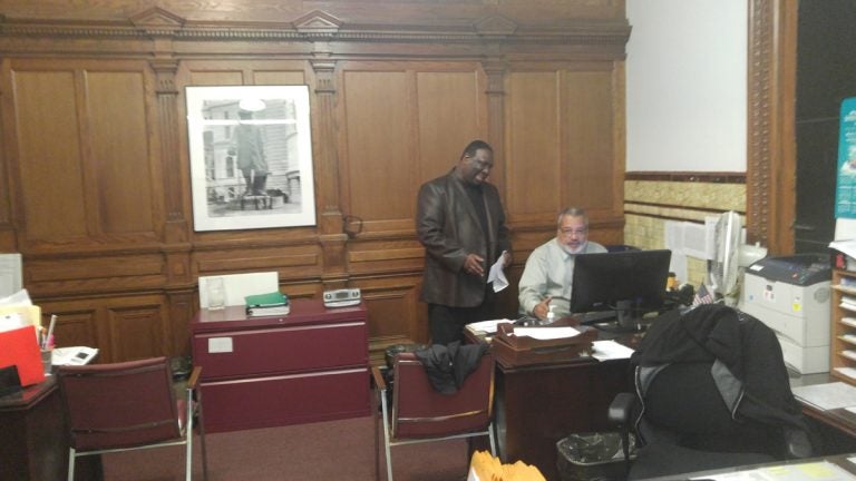  Philadelphia City Commissioner Anthony Clark, left, was in his office on Monday. (Tom MacDonald/WHYY) 