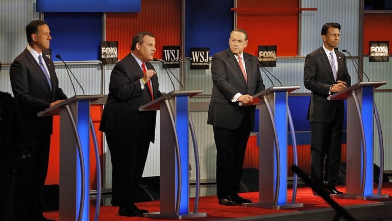  Chris Christie, second from left, speaks as Rick Santorum, left, Mike Huckabee and Bobby Jindal look on during Republican presidential debate at Milwaukee Theatre, Tuesday, Nov. 10, 2015, in Milwaukee. (AP Photo/Morry Gash) 