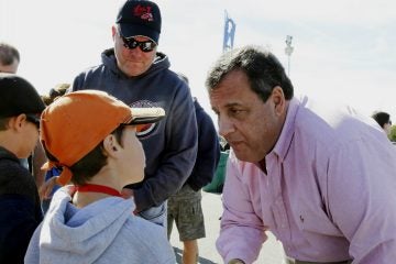 Chris Christie shakes hands with NASCAR fans at the New Hampshire Motor Speedway in September in Loudon