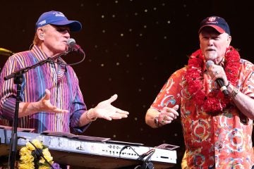  Bruce Johnston, left, and Mike Love of the band The Beach Boys perform on Tuesday, Aug. 18, 2015, in Lancaster, Pa. (Photo by Owen Sweeney/Invision/AP) 