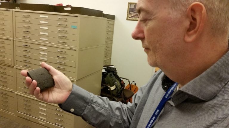 That's not a Blackberry. Philip Jones at the Penn Museum holds a 5000 year old cunieform tablet