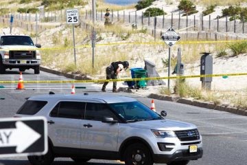 A bomb squad technician near the garbage can explosion site in Seaside Park Saturday