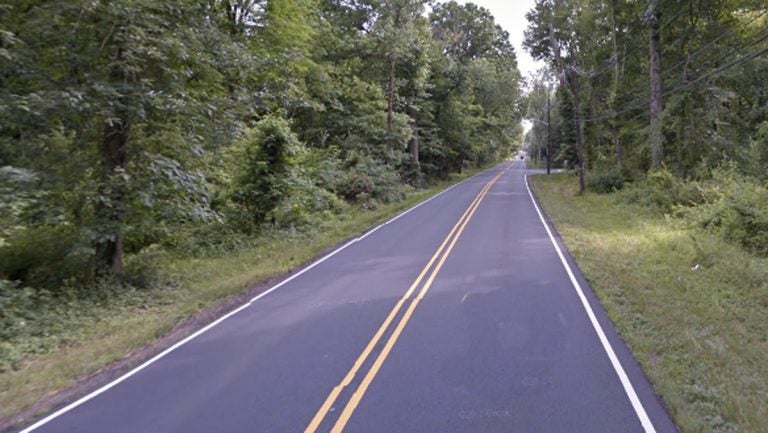 Xufeng Huang was found in the wooded section of Mercer Road shown here. (Google Street View)