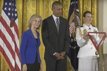 Elaine Pagels (left) about to receive a National Humanities Medal from President Obama (center) (Image  from WhiteHouse.gov)