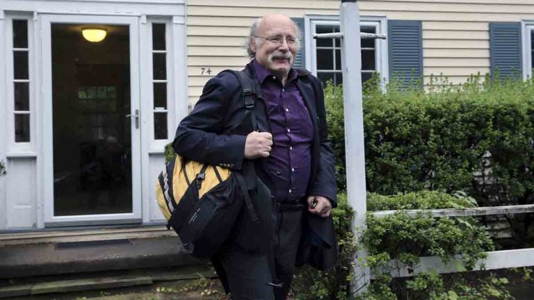 Princeton University physics professor F. Duncan Haldane leaves his home after it was announced that he and two others have been awarded the 2016 Nobel Prize in Physics early Tuesday