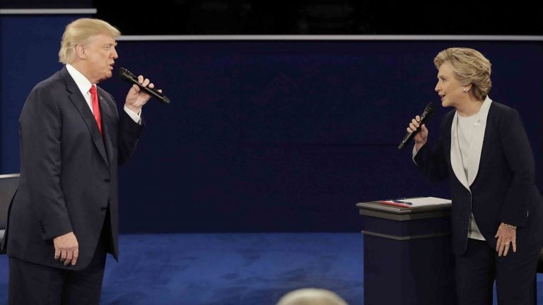 Republican presidential nominee Donald Trump and Democratic presidential nominee Hillary Clinton exchange ideas during the second presidential debate at Washington University in St. Louis