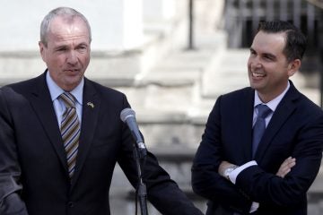 Phil Murphy (left) speaks after receiving the endorsement from Jersey City Mayor Steve Fulop.  (AP Photo/Julio Cortez)