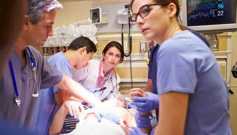 A medical team works on a patient (Big Stock image)