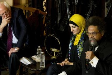 Cornel West (right) speaks as Linda Sarsour (center) and Bernie Sanders listen in Brooklyn April 16