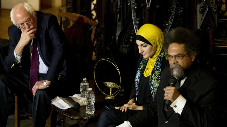 Cornel West (right) speaks as Linda Sarsour (center) and Bernie Sanders listen in Brooklyn April 16