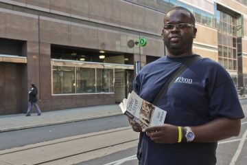 Quaris Carter, 38, was told by his Community College of Philadelphia sociology professor to ride SEPTA's 23 bus from Center City through North Philadelphia to Chestnut Hill and read a book by famed sociologist Elijah Anderson's book 'Code of the Street.' (Kimberly Paynter/WHYY)