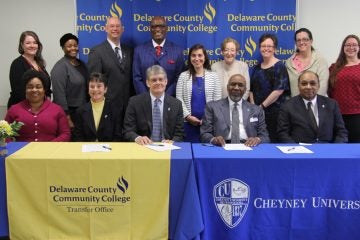 Delaware County Community College President Jerry Parker (center