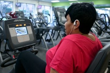 Donna Williams listens to R&B hits at the Phila U. campus gym. The Phila U. employee visits gym three times a week. (Bastiaan Slabbers/for NewsWorks)