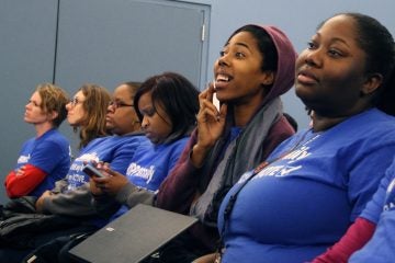 KIPP charter school supporters wait to hear whether applications for two new charters will be approved. (Emma Lee/WHYY)