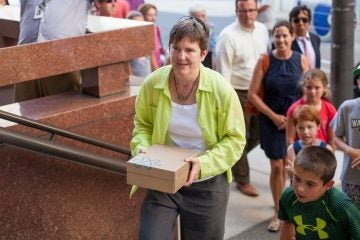  Fired teacher Margie Winters delivers petitions signed by more than 20,000 supporters who are seeking to have her reinstated at Waldron Mercy Academy. Winters, who was let go because of her same-sex marriage, handed the pleas to a Archdiocese of Philadelphia security guard.(Brad Larrison/for NewsWorks) 