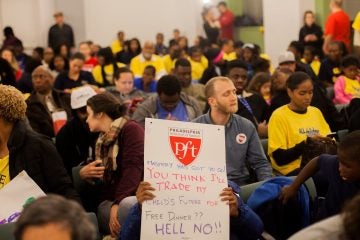  Advocates for and against converting three neighborhood schools to charters packed district headquarters Thursday night. (Photo by Brad Larrison for Newsworks) 