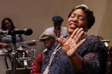 Rutgers Camden alumna Dionne Grooms-Fields belts out 'Goin' Crazy with the Blues' during rehearsal at the Walter K. Gordon Theater. (Emma Lee/WHYY)