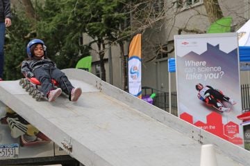 After building a miniature luge kids were able to test the action sliding down down a track themselves (Natavan Werbock/for NewsWorks)