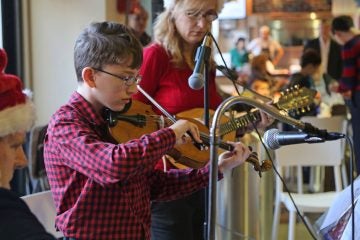 Nicholas Arisi, 11, a student at Cintioli Music School performing on violin (Natavan Werbock/for NewsWorks)