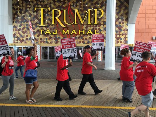 Atlantic City Unite Here Local 54 union members walk the picket line as they strike the Trump Taj Mahal (Anthony Smedile for NewsWorks)