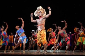  Jelani Remy as the older Simba and the ensemble in the song 'He Lives in You' from 'The Lion King' national tour. (Photo courtesy of Joan Marcus)  