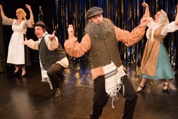  From left, Tracie Higgins, Jeffrey Coon, Tony Braithwaite and Elena Camp spoof 'Fiddler on the Roof' in 'Forbidden Broadway's GreatestHits' at Act II Playhouse in Ambler. (Photocourtesy of Mark Garvin) 