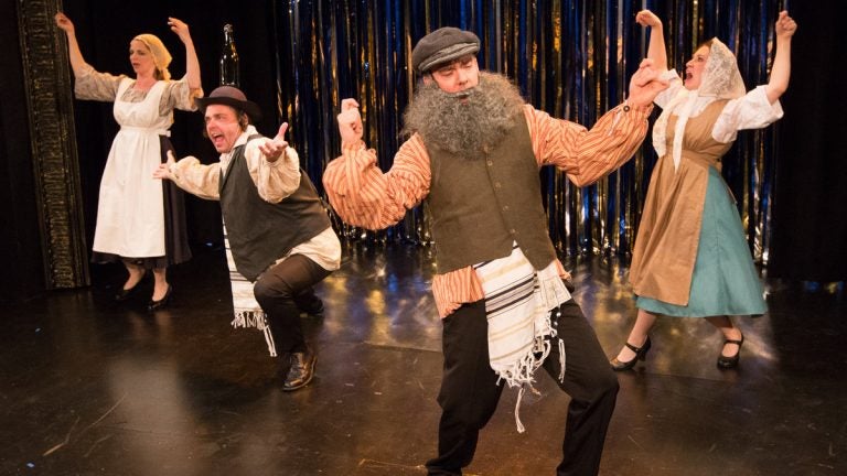  From left, Tracie Higgins, Jeffrey Coon, Tony Braithwaite and Elena Camp spoof 'Fiddler on the Roof' in 'Forbidden Broadway's GreatestHits' at Act II Playhouse in Ambler. (Photocourtesy of Mark Garvin) 