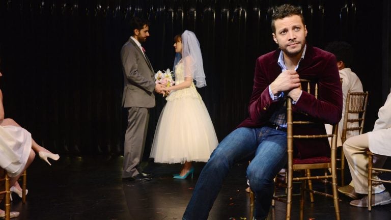  In the foreground, Justin Guarini, with John Caliendo and Kate Wetherhead in the background in Bucks County Playhouse's production of 'Company.' (Photo courtesy of Mandee Kuenzle)   