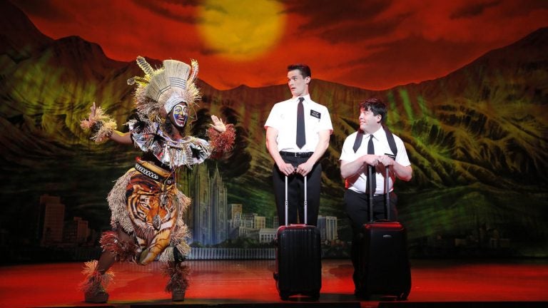  Kelechi Ezie (left) greets KJ Hippensteel and Christopher John O'Neill, as two would-be Mormon proselytisers, in 'The Book of Mormon' at the Forrest Theatre 