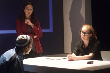J. Paul Nicholas is interrogated by Felicia Leicht and Isa St. Clair in the Inis Nua production of 'Ciphers.' (Photo courtesy of Katie Reing)