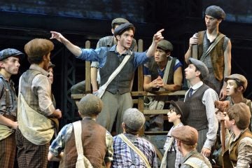  Dan DeLuca gives instructions to the striking newsboys in 'Newsies,' beginning its national tour at the Academy of Music. (Photo courtesy of Deen van Meer) 