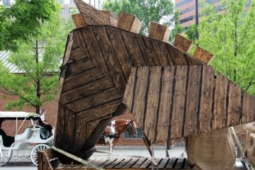 The Trojan Horse beds down for the night on Fifth Street, blending with the carriage horses. (Emma Lee/WHYY)